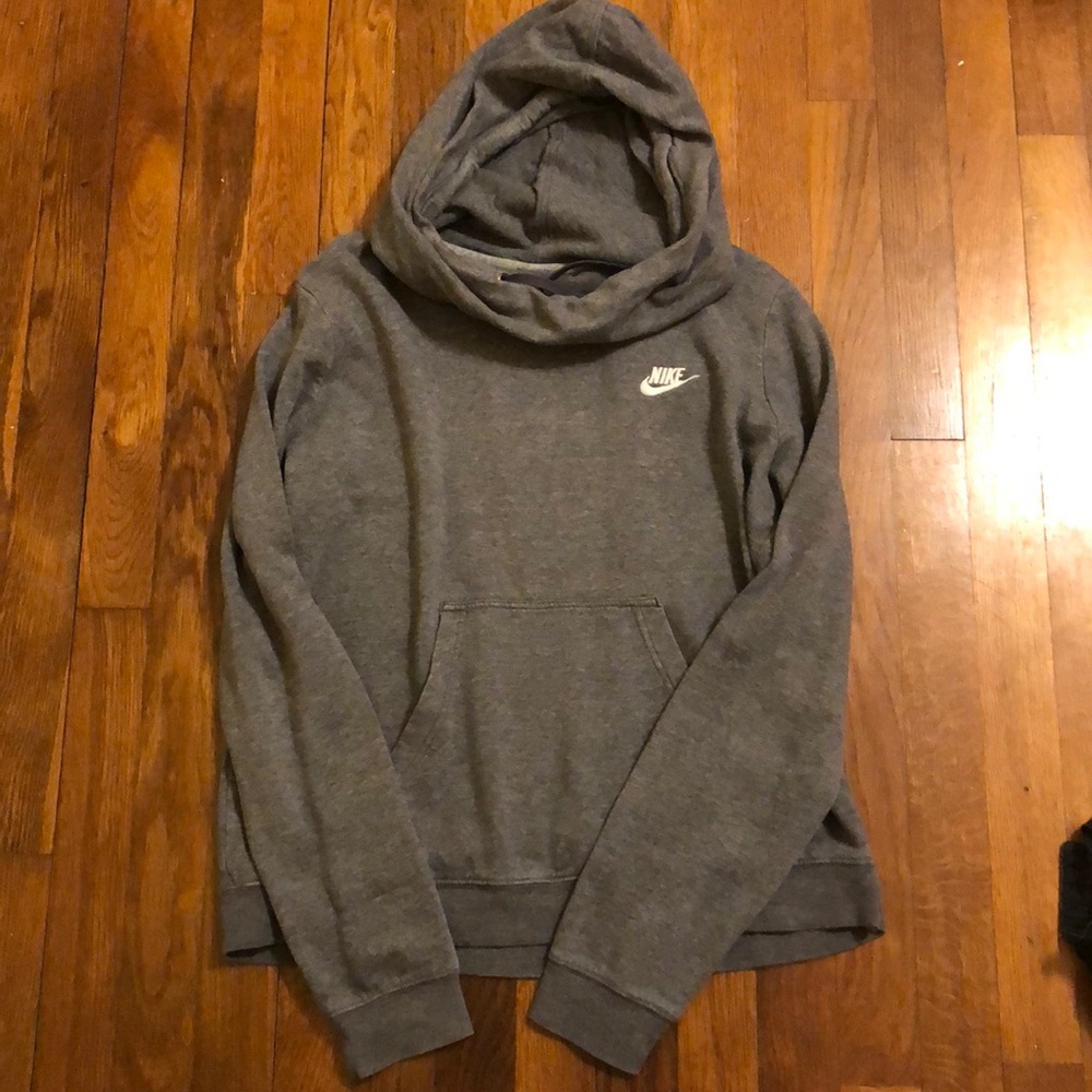 a grey nike jacket.